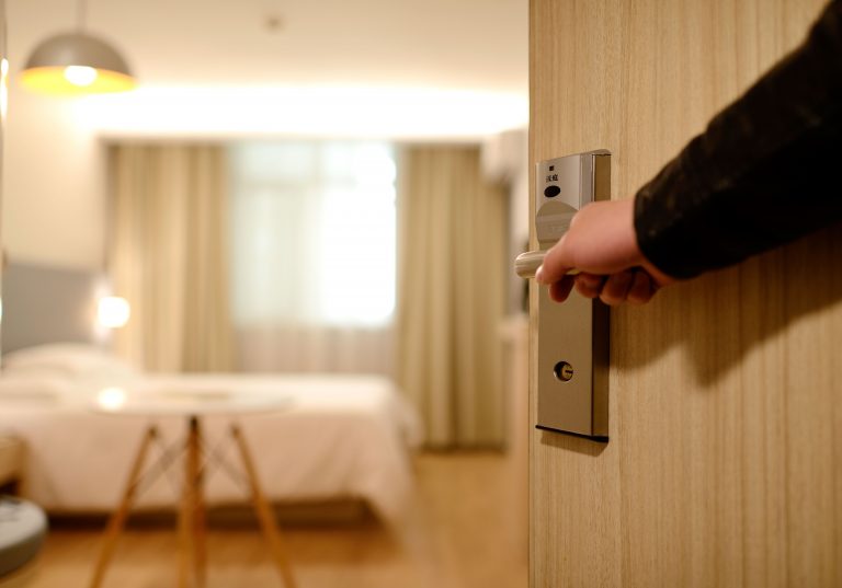 Guest Opening Hotel Room Door